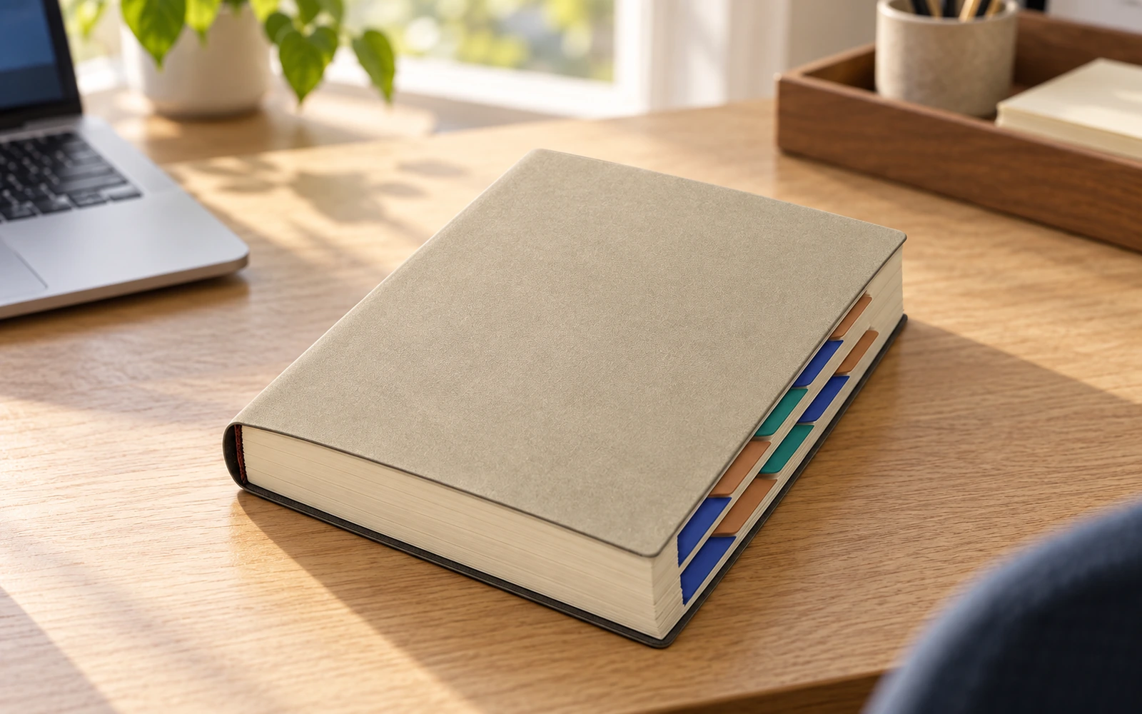 Tabbed hardbound planner on an office desk for education and office use